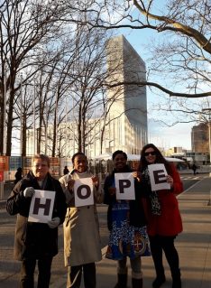 GB members at the United Nations holding pages spelling 'hope'