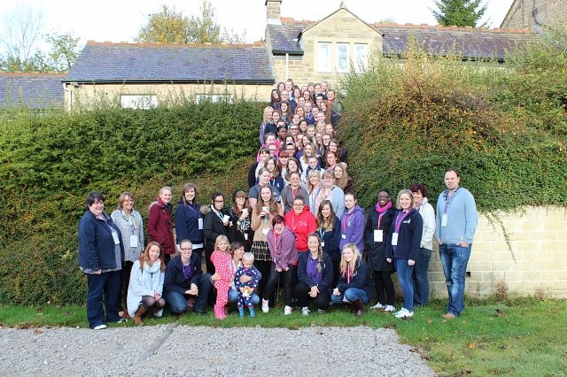 Girls' Brigade Queen's Award participants stood on stairs