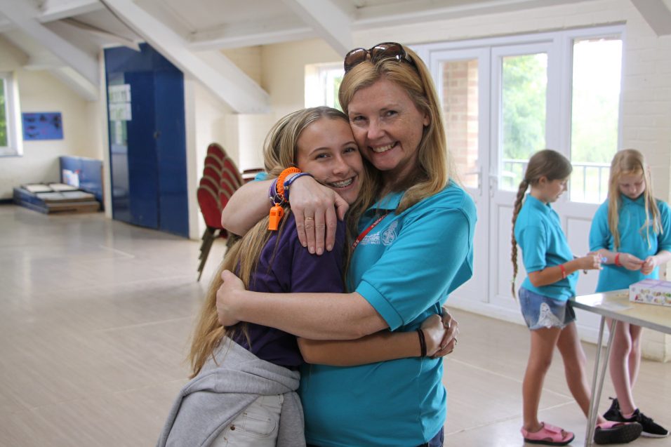 Girls' Brigade leader hugging n:spire girl