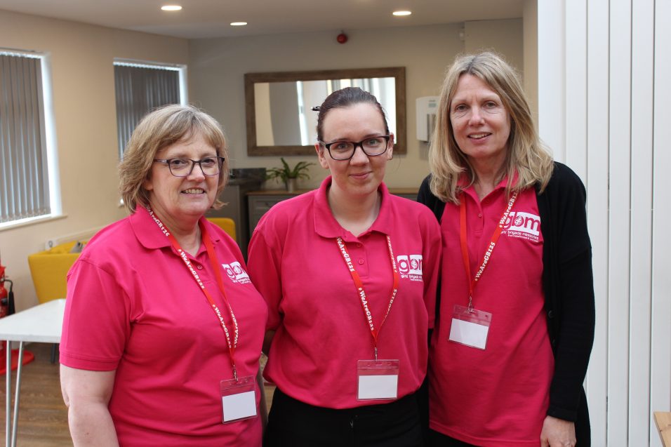 three members of Girls' Brigade Ministries staff team stood together smiling at camera