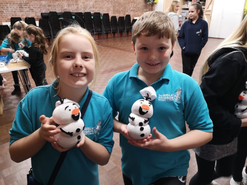 n:gage members holding sock snowmen crafts