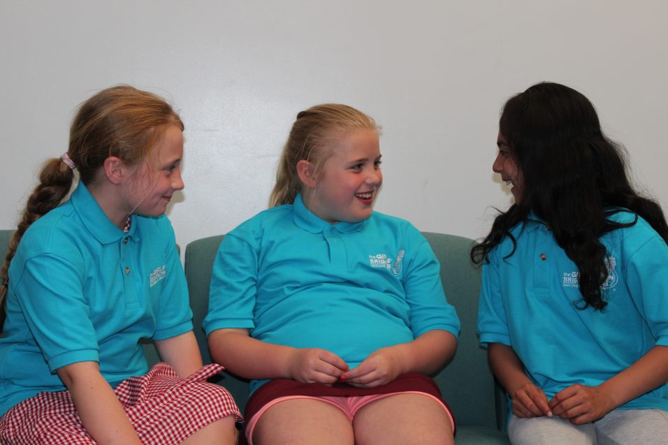 three n:gage girls sat chatting on chairs