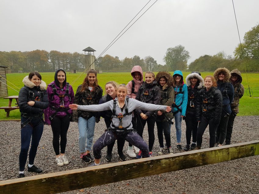 Leaders and young women having fun at PGL centre