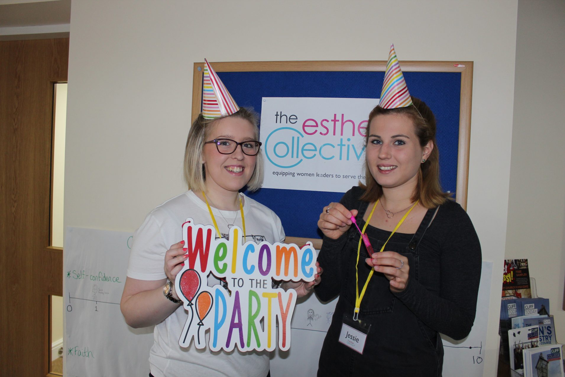 Young women in party hats at Esther Collective