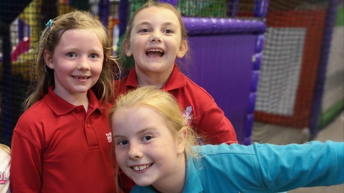 three girls in soft play area