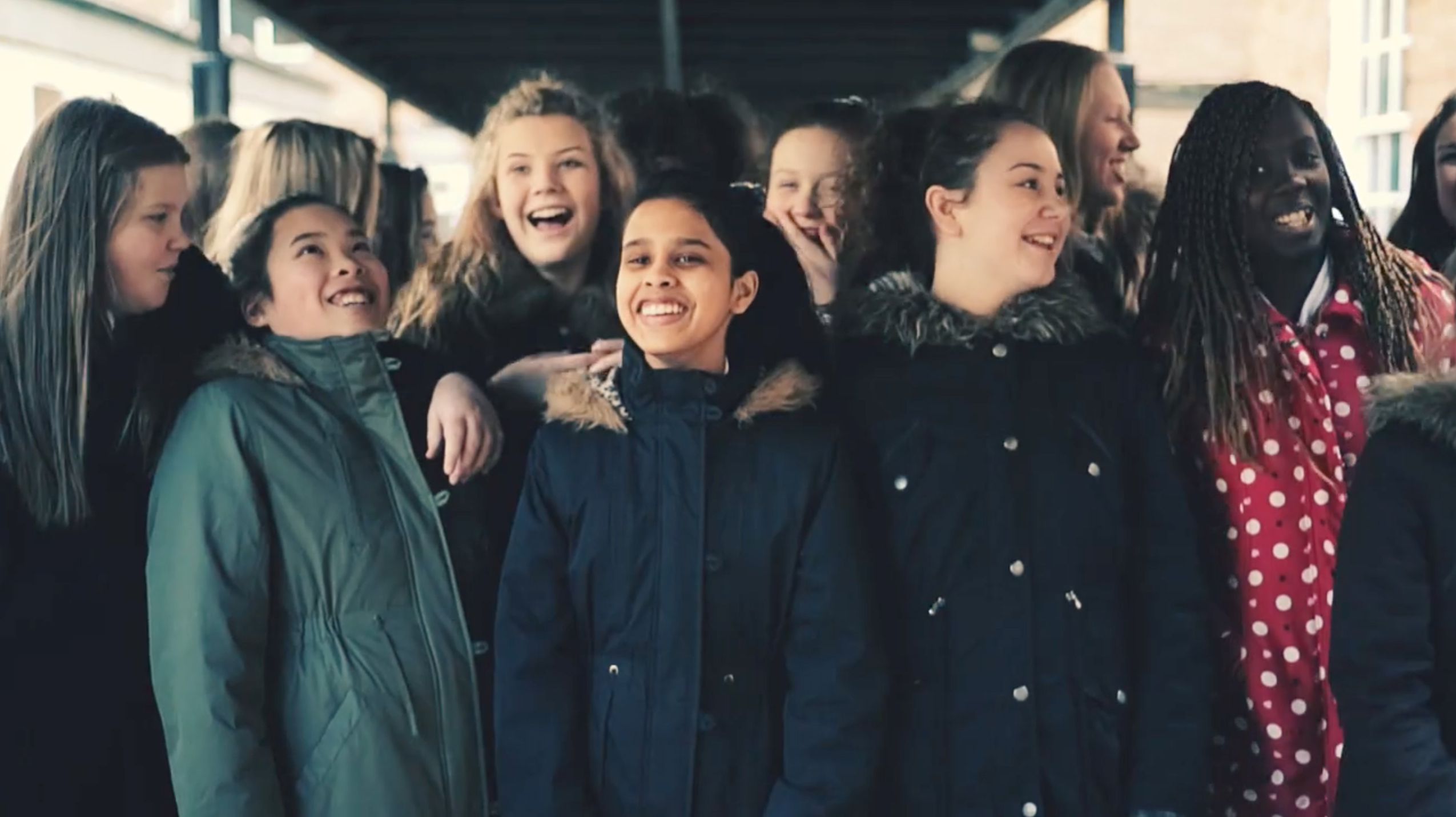 Group of girls laughing and smiling together