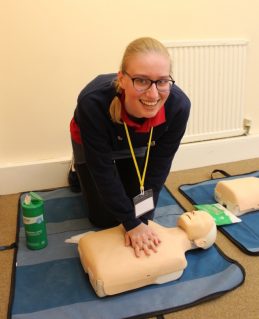GB volunteer practicing first aid on a resuscitation doll