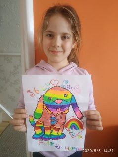 Girl holding a fudge the dog colouring page