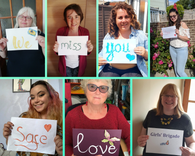 GB leaders holding up signs reading 'we miss you, stay safe, love Girls' Brigade'