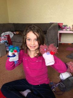 GB member at home with crafted sock puppets