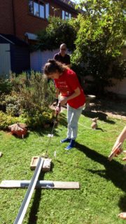 GB member playing crazy golf in the garden