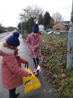 GB members collecting litter on a street