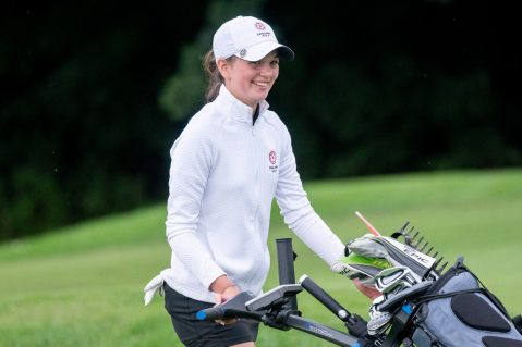 Photo of Emma Gourley with golf trolley