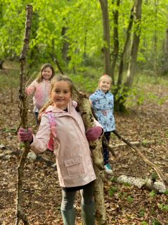 1st Hawkwell members with sticks in the woods