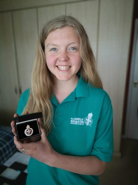 Grace Claydon holding Queen's Award