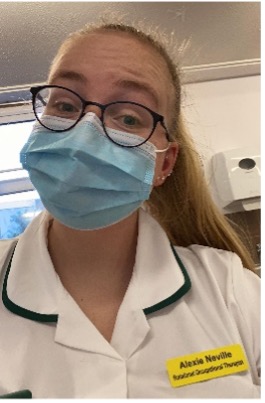 Alexie Neville in work uniform wearing mask