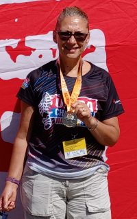 Janice with half-marathon medal