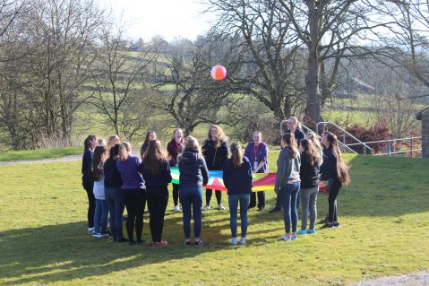 Queen's Award participants playing parachute games