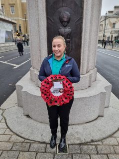 Hayley Flint holding poppy wreath