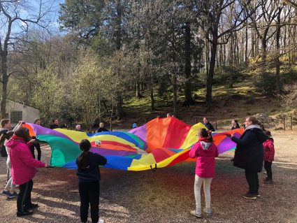 GB members playing parachute games