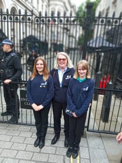 GB volunteer and members posing for photo at Downing Street