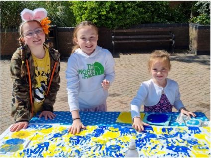 GB members taking part in handprint craft