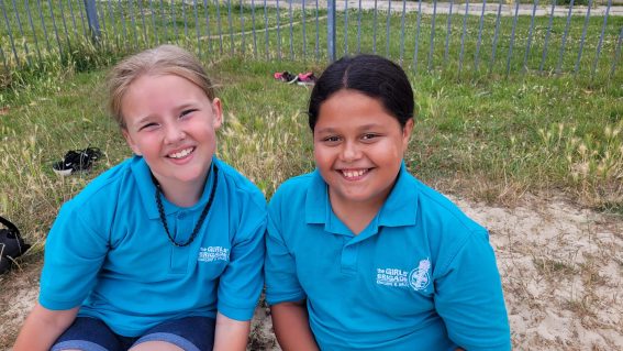 n:gage members sat on grass in park