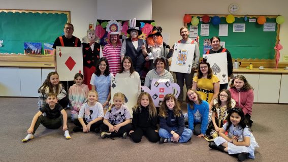 GB volunteers and members dressed up as Alice in Wonderland characters