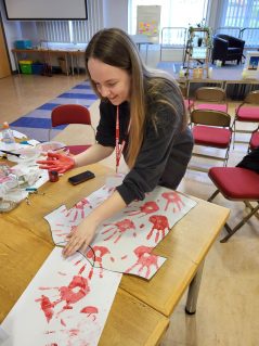 Queen's Award participant creating handpainting craft