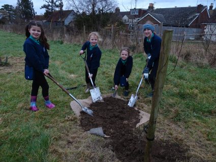 1st Hurstpierpoint members digging with spades