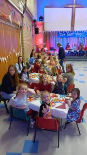 GB members sat around tables decorated with red, white and blue