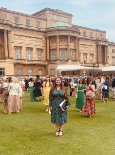 GB member on lawn of Buckingham Palace