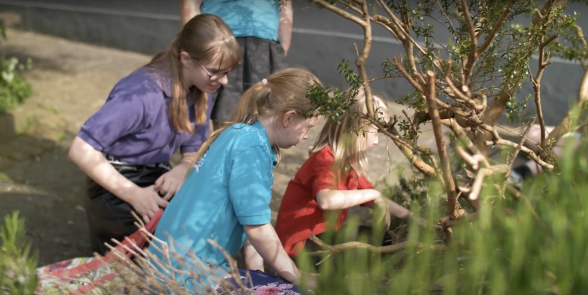 GB members tending to plants in church garden