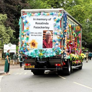 Back of flower garden truck with display of Rosalinda's memorial