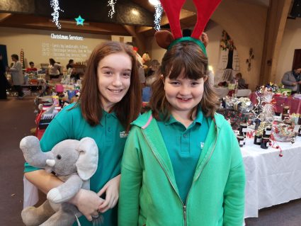 n:counta members posing for a photo at a Christmas fayre