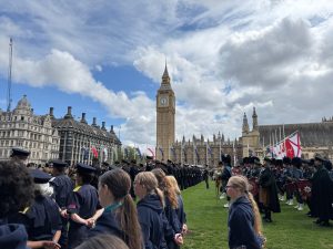Girls in parade with view of London.