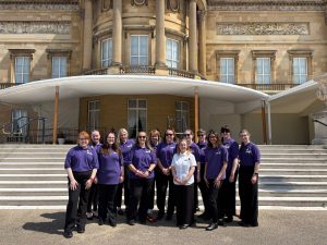 Group of stewards gathered at Buckingham Palace.